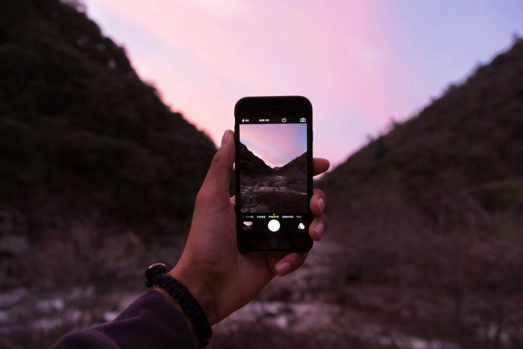 From Accident to Justice: A Journey Through the Injury Law Process 1 person holding iPhone displaying camera application