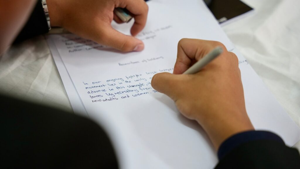 From Accident to Justice: A Journey Through the Injury Law Process 6 A person writing on a piece of paper